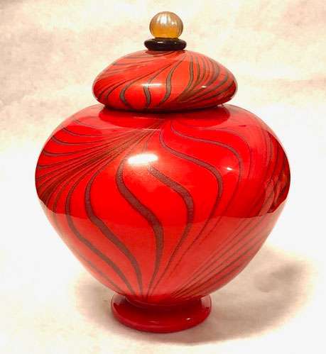 Orange pulled lines urn